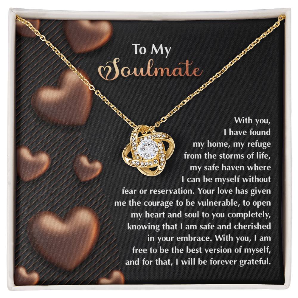 The Soulmate-Best Version Love Knot Necklace is elegantly displayed on a card with a heartfelt "My Soulmate" message, featuring heart graphics and adorned with sparkling cubic zirconia crystals, all in a beautiful gold finish.