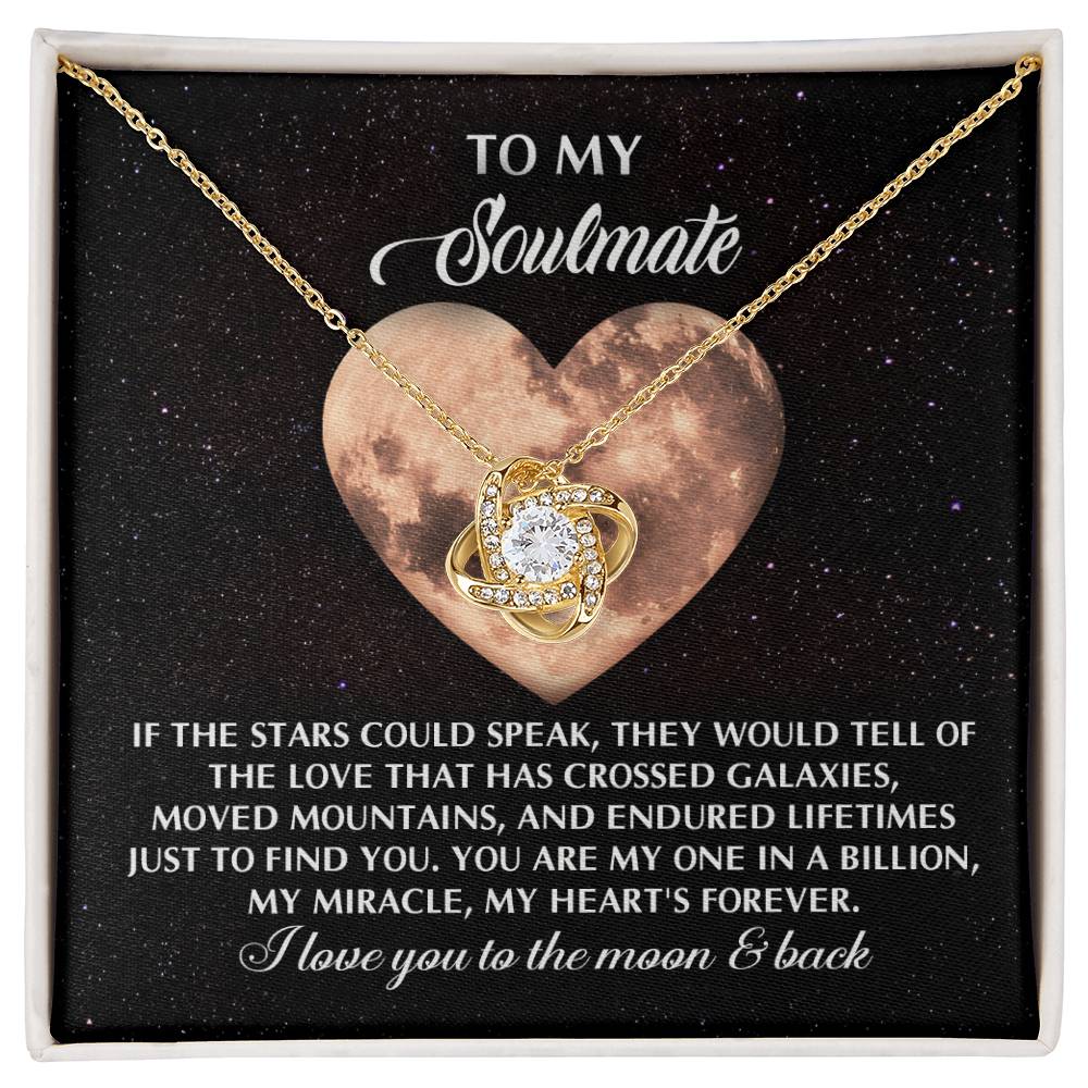 The Soulmate-Crossed Galaxies - Love Knot Necklace, adorned with a central gem and sparkling cubic zirconia crystals, comes in a gift box. It features a heart-shaped moon backdrop with heartfelt text, making it an ideal personalized gift for your soulmate.