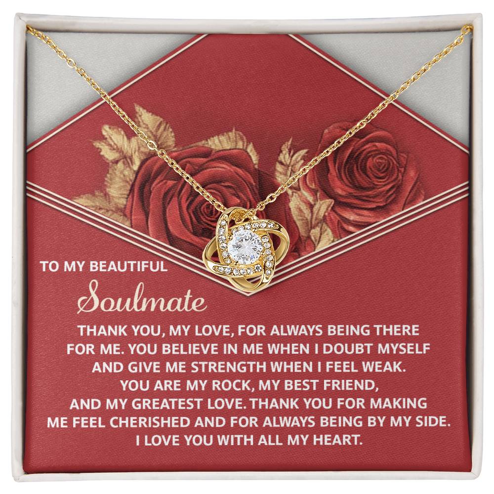 The Soulmate-All My Heart - Love Knot Necklace showcases a heart-shaped pendant with cubic zirconia crystals. It's elegantly displayed on a card featuring red roses and a heartfelt message, making it the perfect personalized gift to express love and gratitude to your soulmate.