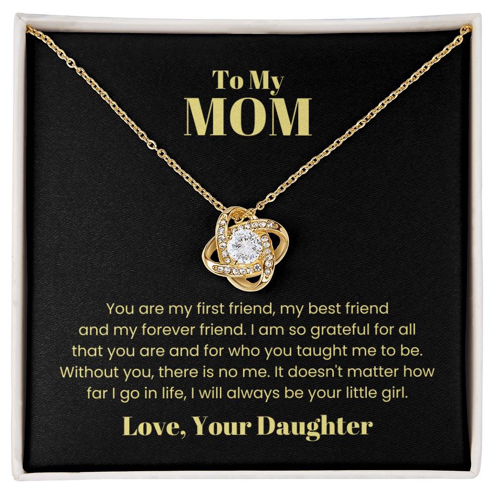The "To My Mom, You Are My First Friend - Love Knot Necklace" features intertwined loops adorned with a central cubic zirconia crystal, displayed against a black background with a heartfelt message of gratitude and affection from a daughter.