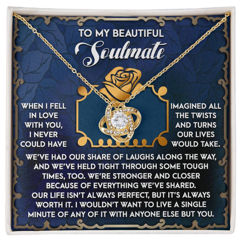 The Soulmate-The Way Love Knot Necklace, featuring a cubic zirconia pendant, is set against a backdrop with a heartfelt message about love and companionship.