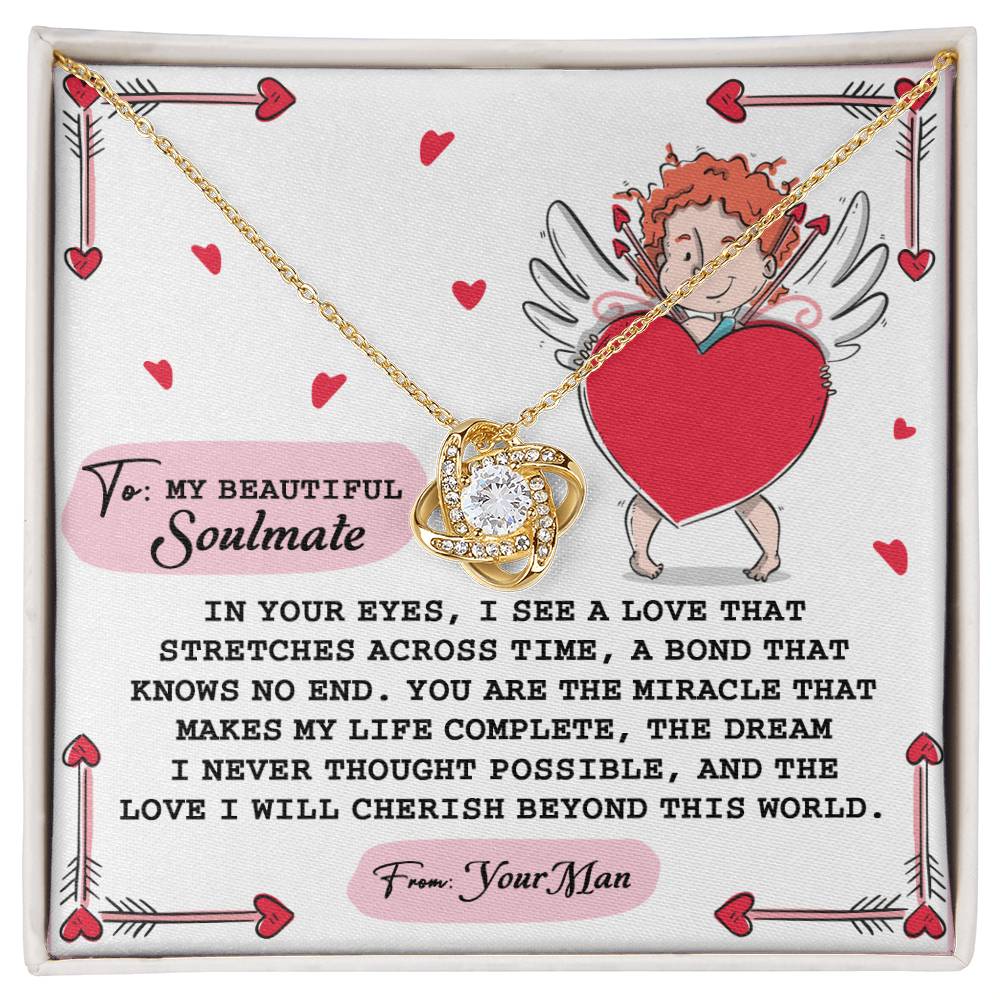 The Soulmate-No End Love Knot Necklace features intertwined hearts with cubic zirconia, on a card with a heartfelt message and cupid illustration, symbolizing eternal devotion.