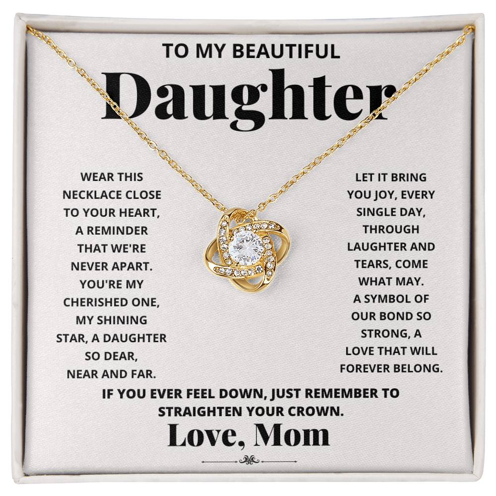 To My Beautiful Daughter, Wear This Necklace - Love Knot Necklace shaped pendant necklace with encrusted jewels on a card with a sentimental message from a mother to her daughter.