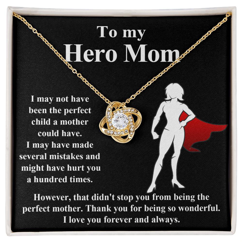 The "To Mom, The Perfect Mother - Love Knot Necklace" features a stunning diamond pendant set against a black background, beautifully conveying heartfelt gratitude for a mother's unconditional support and love. This elegant piece is available in both white gold and yellow gold finishes.