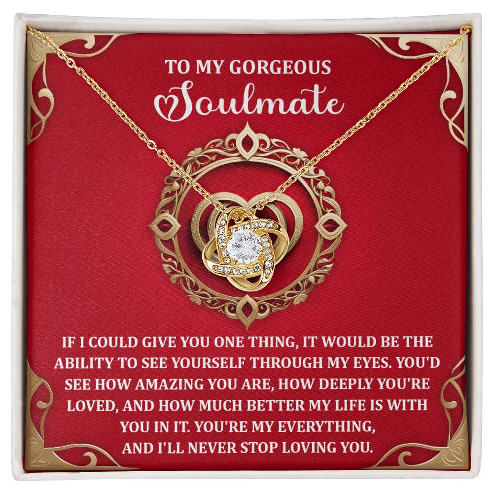 The Soulmate-Through My Eyes Love Knot Necklace features a heart with sparkling cubic zirconia crystals on a red background, paired with a romantic message for a "Gorgeous Soulmate.