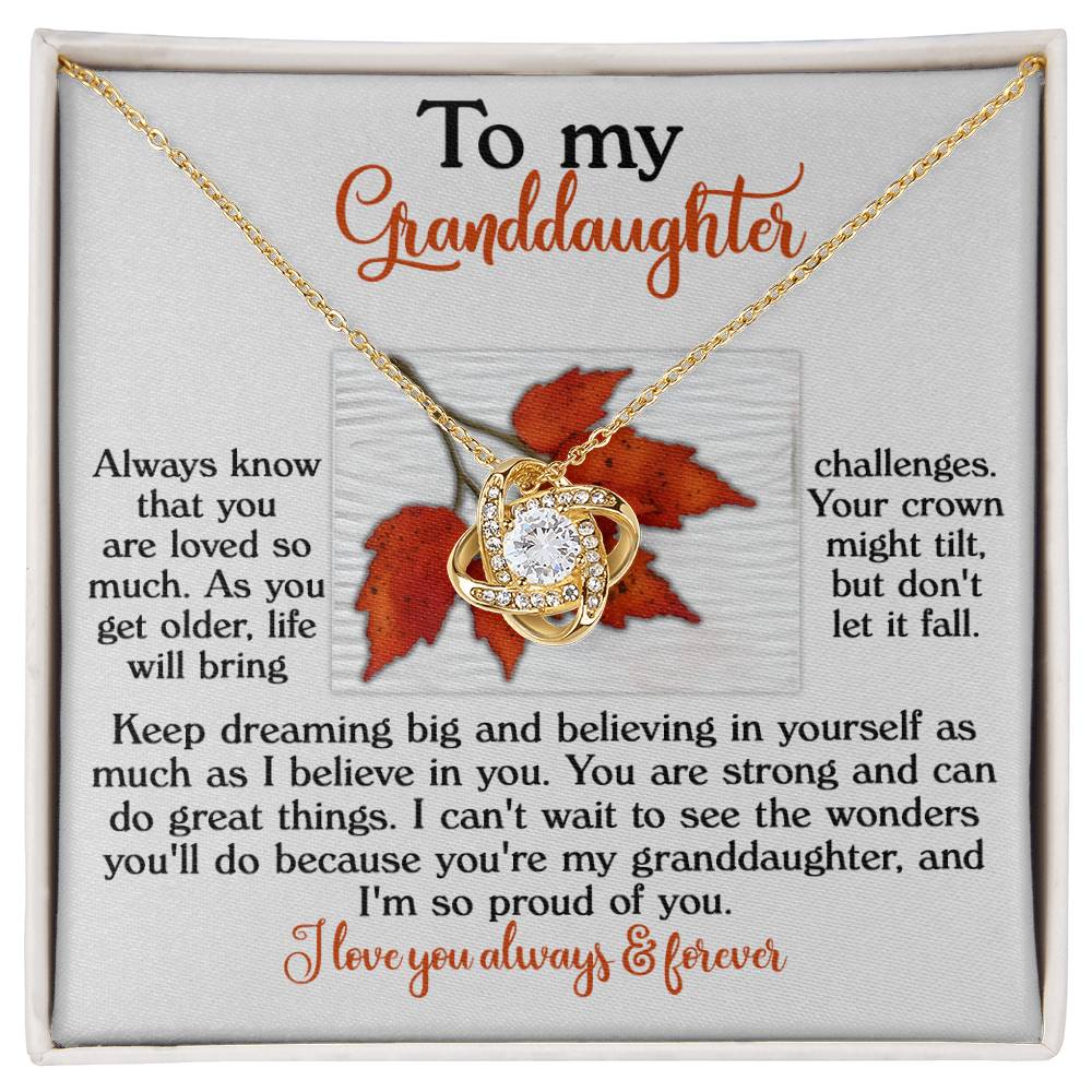 Surprise your granddaughter with the Granddaughter-Do Great Things Love Knot Necklace, showcasing a lustrous gold-finish pendant embellished with cubic zirconia crystals. It's elegantly displayed on a card featuring an autumn leaf design, accompanied by a heartfelt message that will fill her with warmth and love she'll always treasure.