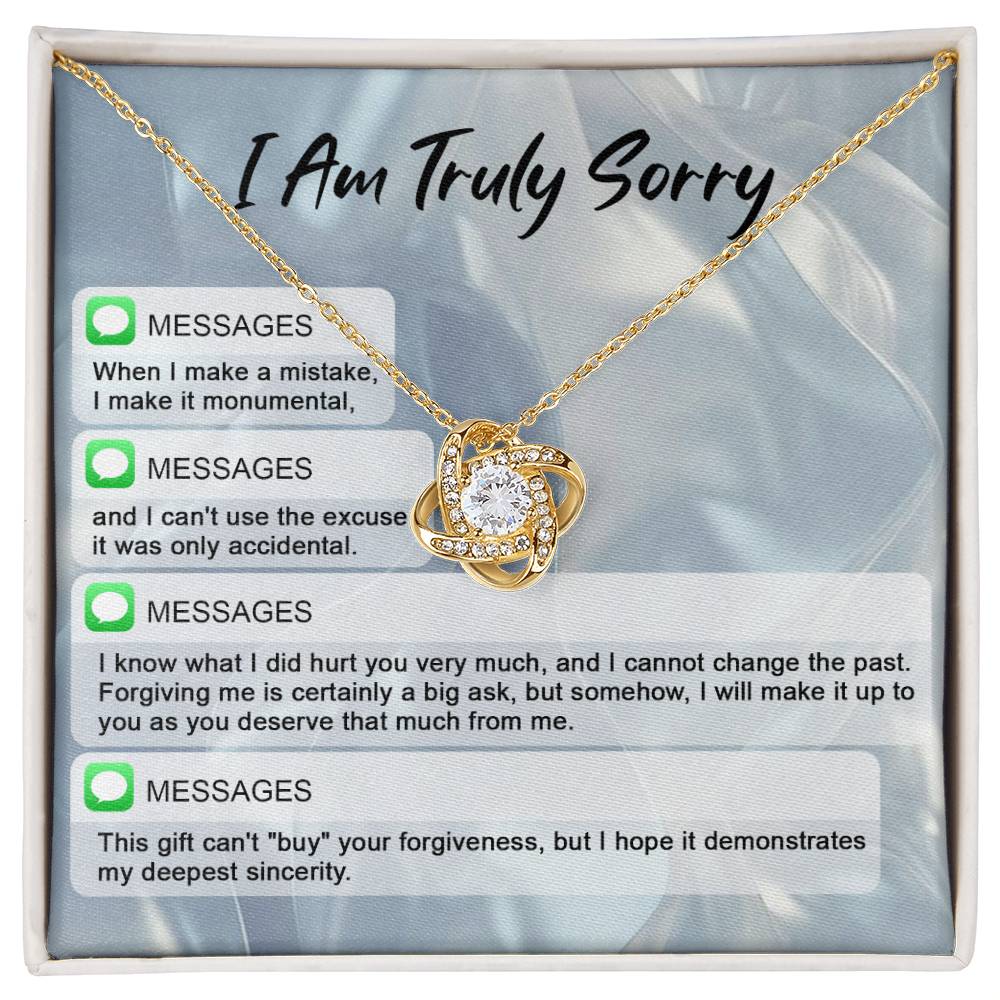 The "Sorry, Make A Mistake - Love Knot Necklace" adorned with cubic zirconia crystals, placed over a background card that reads "I Am Truly Sorry" and includes a series of apology text messages, is the perfect personalized gift for heartfelt apologies.
