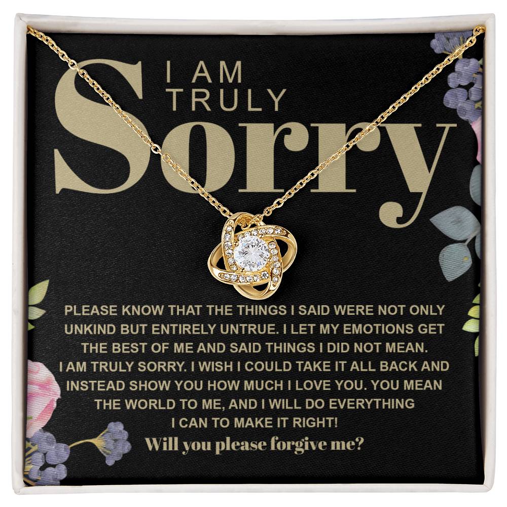 The Sorry-Best Of Me - Love Knot Necklace, featuring a heart-shaped cubic zirconia crystal pendant, is elegantly presented on a card with an apology message expressing deep regret and a sincere plea for forgiveness.