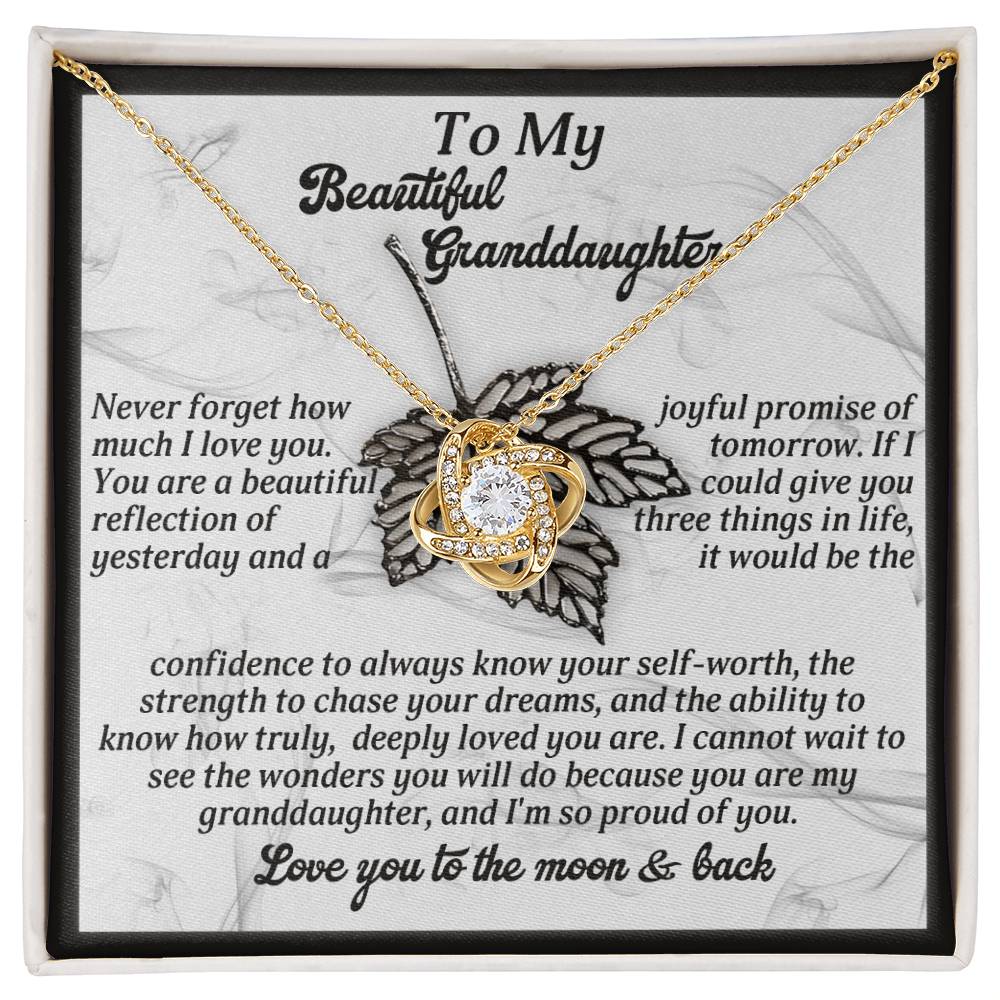This personalized gift showcases the Granddaughter-Deeply Loved - Love Knot Necklace with a heart and cubic zirconia centerpiece, elegantly displayed in a gift box featuring a sentimental message for your granddaughter.