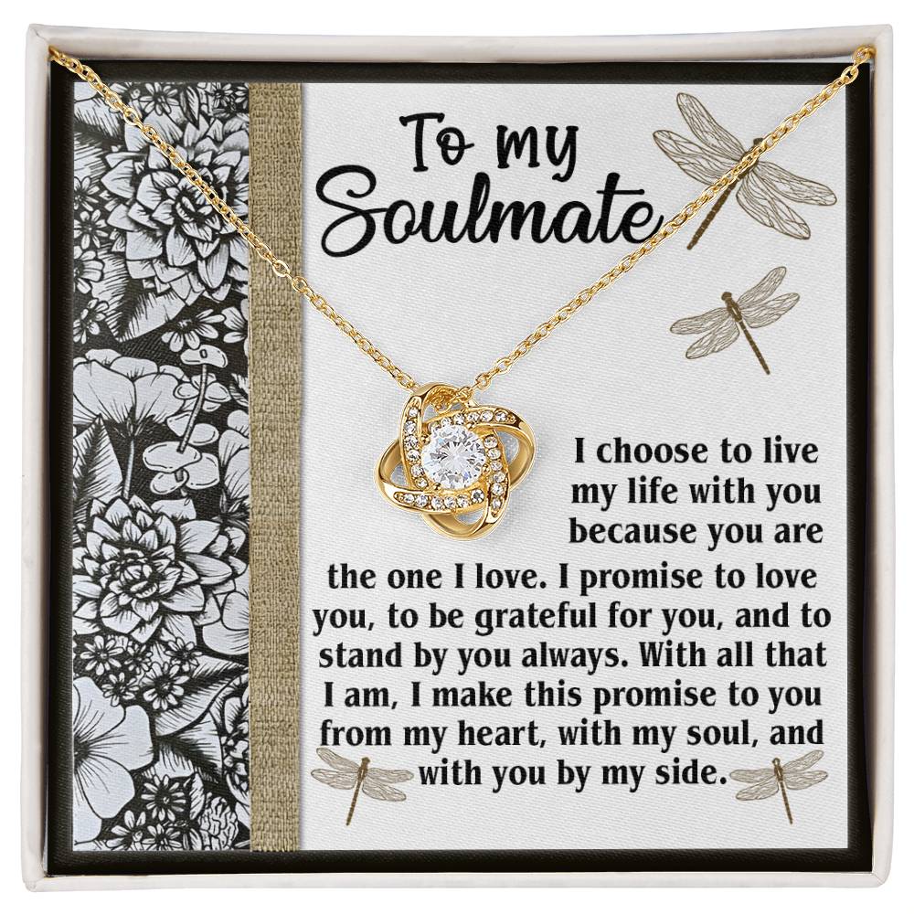 Introducing the Soulmate-Make This Promise - Love Knot Necklace, elegantly displayed in a box inscribed with "To my Soulmate." Included is a heartfelt message about love, gratitude, and commitment. The necklace features a gold-finish chain and a pendant with intertwined hearts adorned with shimmering cubic zirconia.