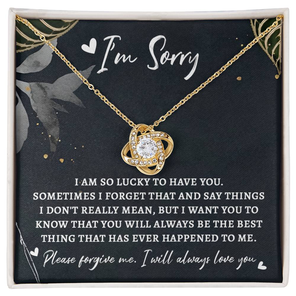 The "Sorry-The Best Thing - Love Knot Necklace" features a gold pendant with a central premium cubic zirconia, presented in a box adorned with an "I'm Sorry" message, beautifully conveying regret and love.