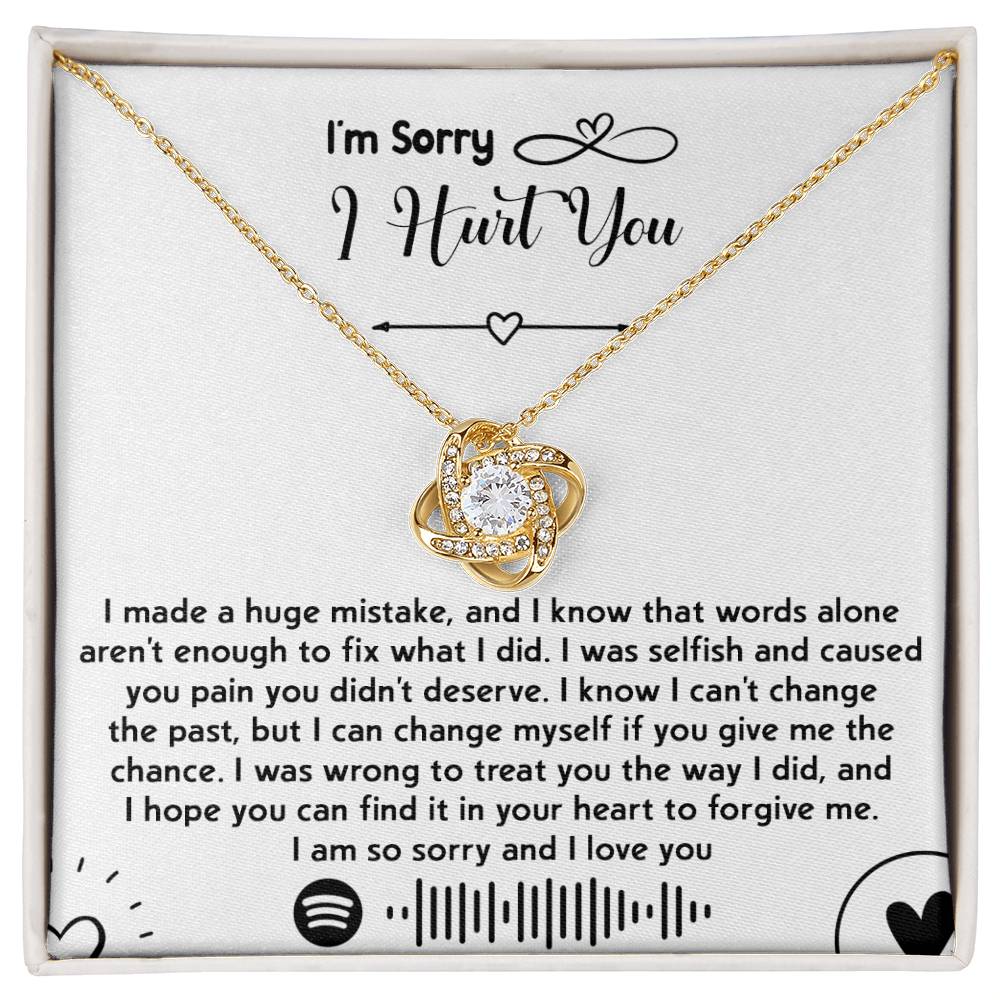 The "Sorry-You Didn't Deserve - Love Knot Necklace" features an intertwined heart pendant adorned with cubic zirconia crystals and a gold finish, beautifully presented in a box with a heartfelt apology message. The message conveys deep regret, asks for forgiveness, and promises to change.