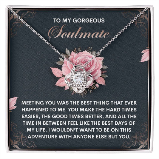 The Soulmate-Best Days Love Knot Necklace features an intertwined heart design resting in a rose-adorned box. Accented with cubic zirconia crystals, the text on the box conveys gratitude and love for a soulmate, creating an ideal personalized gift.