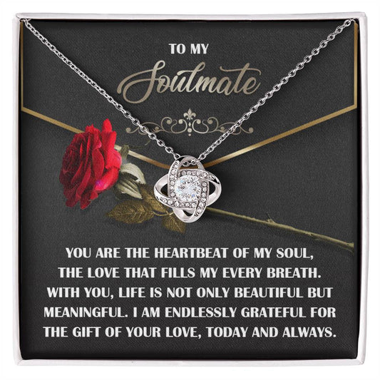 The Soulmate–My Every Breath Love Knot Necklace, adorned with sparkling cubic zirconia, comes in a box with a radiant red rose and a heartfelt message for your soulmate, making it the perfect personalized gift.