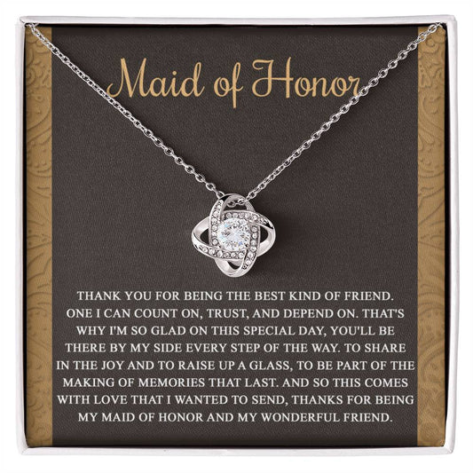 The "To Maid of Honor, Kind Of Friend - Love Knot Necklace" features an intertwined knot design adorned with cubic zirconia crystals on a background that reads "Maid of Honor," followed by a heartfelt thank you message to the maid of honor.