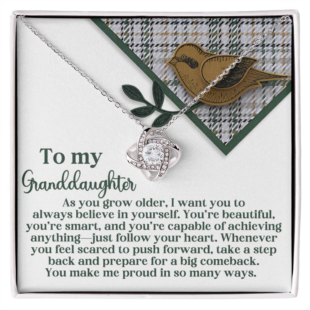 Introducing the "Granddaughter-A Big Comeback - Love Knot Necklace," which features an interlocking design beautifully adorned with Cubic Zirconia Crystals. It rests on a card showcasing a charming bird and leaf motif, accompanied by a heartfelt message for your granddaughter. Available in a choice of White Gold or Yellow Gold Finish, it elegantly symbolizes unbreakable bonds.