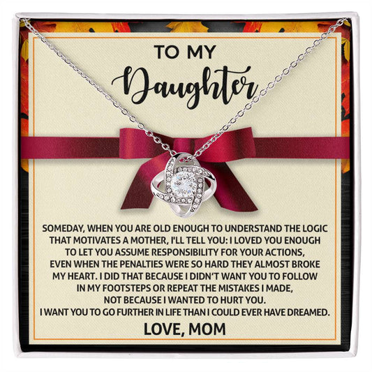 The Daughter-Further In Life Love Knot Necklace, featuring intertwined hearts, is beautifully presented on a note from a mother to her daughter. It conveys love, guidance, and aspirations for her daughter’s success. Available in either white gold or yellow gold finishes with sparkling cubic zirconia crystals, this necklace accentuates the heartfelt message signed "Love, Mom.