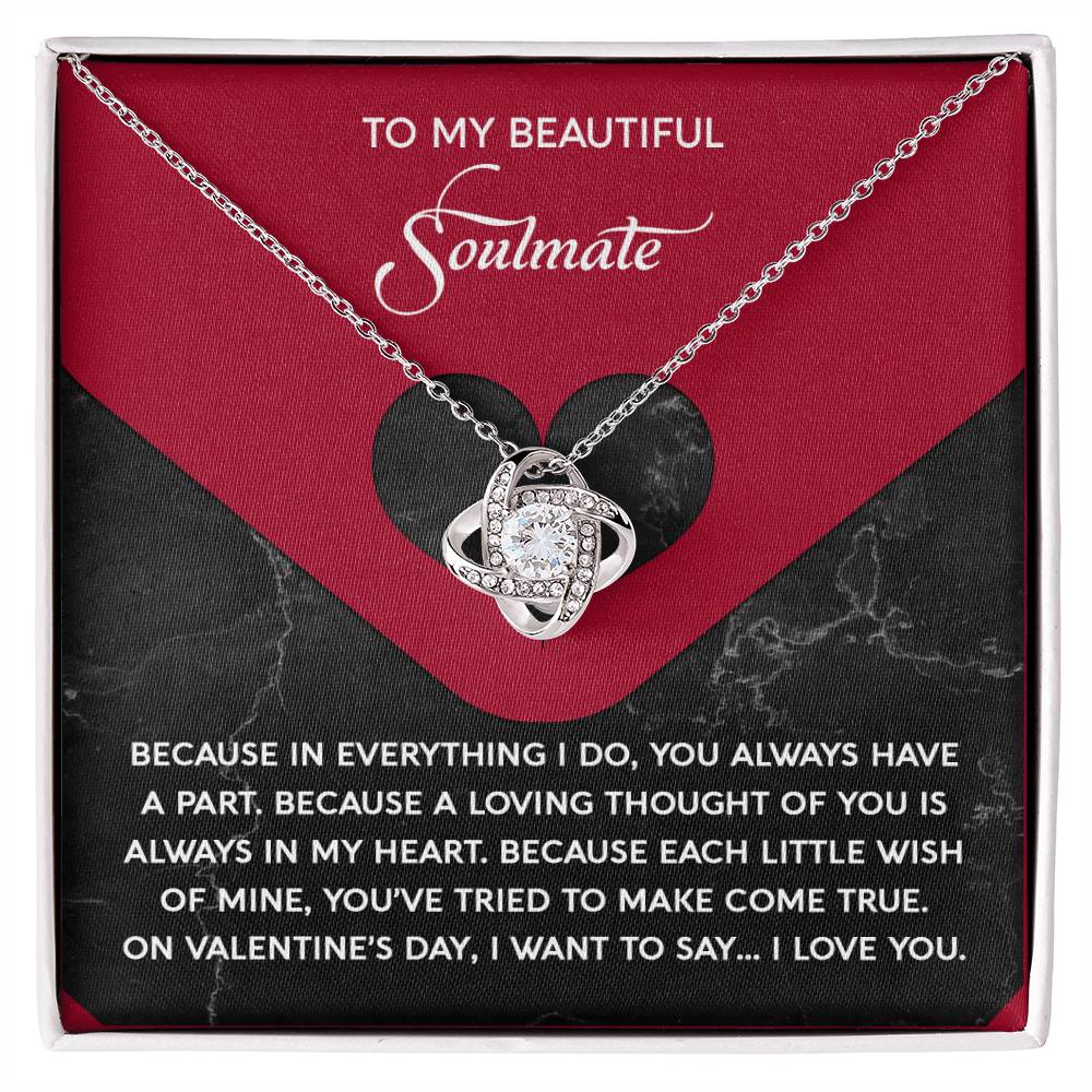 The Soulmate-Loving Thought - Love Knot Necklace features a heart-shaped pendant adorned with sparkling cubic zirconia crystals, elegantly packaged in a gift box labeled "To My Beautiful Soulmate" with a romantic message.