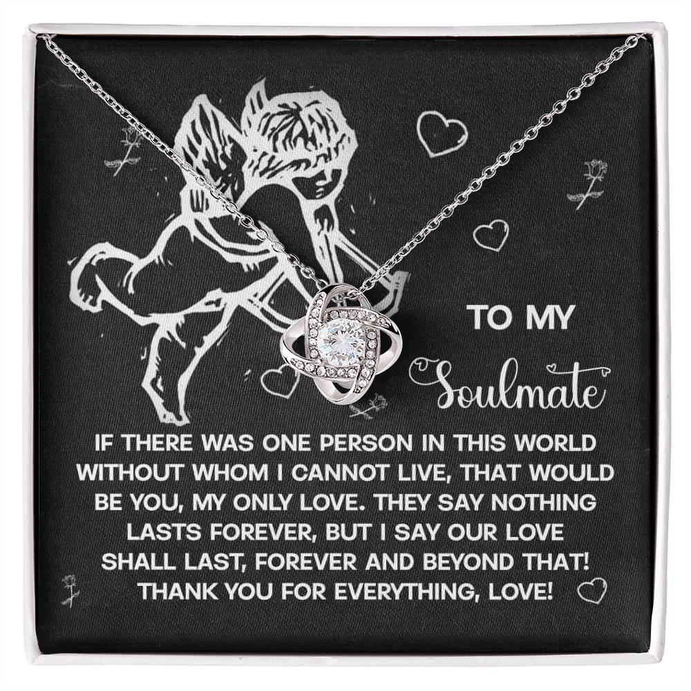 The Soulmate-Lasts Forever Love Knot Necklace showcases a delicate Celtic knot symbolizing an unbreakable bond, presented in a box with an angel illustration and the text expressing everlasting love, enhanced by sparkling cubic zirconia.