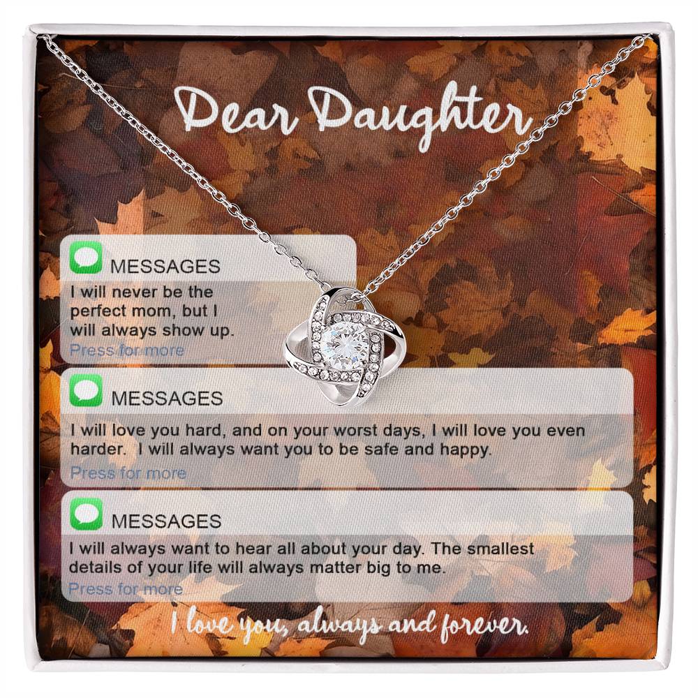 The Daughter-Perfect Mom - Love Knot Necklace, featuring a heart-shaped pendant, is beautifully presented in a box adorned with cubic zirconia crystals and carries a heartfelt message: "Dear Daughter: I may not be the perfect mom, but I will always show up. I love you, always and forever.