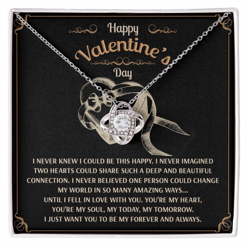 The Soulmate-Amazing Ways - Love Knot Necklace, featuring intertwined rings with sparkling cubic zirconia, is presented on a black card that reads "Happy Valentine's Day" with a romantic message. It's the perfect personalized gift to express timeless love and affection.
