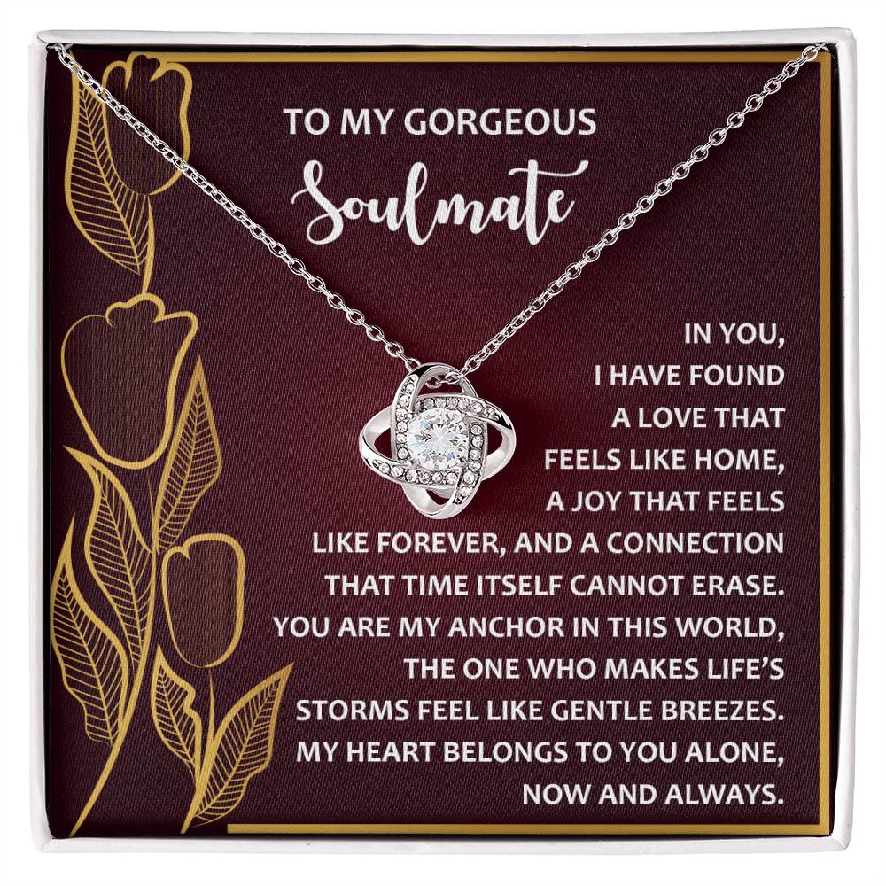 The Soulmate-Gentle Breezes Love Knot Necklace, adorned with cubic zirconia crystals, comes on a floral gift card and features a heartfelt message about love and connection, making it the perfect personalized gift.
