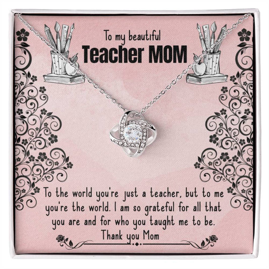 An ornamental ShineOn Fulfillment Love Knot Necklace with cubic zirconia crystals is displayed on a card with a floral design, alongside a heartfelt message dedicated to a "teacher mom," expressing gratitude and admiration.