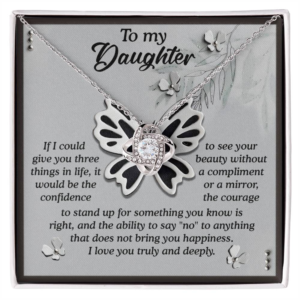 The Daughter-See Your Beauty - Love Knot Necklace comes with a butterfly pendant on a card. The card features the message: "To my Daughter," expressing love and hope for confidence, courage, and happiness without needing validation.