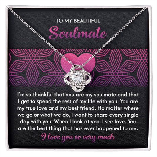 The Soulmate-I See Love - Love Knot Necklace, adorned with sparkling cubic zirconia crystals, comes on a card expressing love and gratitude to your soulmate. Its intertwined design symbolizes an unbreakable bond.