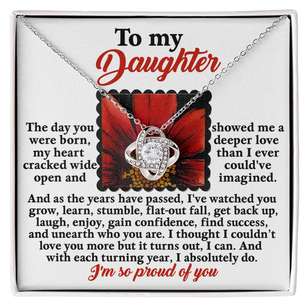 Gift your daughter the Daughter-A Deeper Love - Love Knot Necklace, adorned with cubic zirconia crystals and presented on a card that reads, "To my Daughter" along with a heartfelt message expressing your love and pride as a parent.