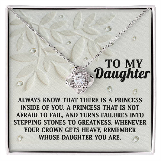 The Daughter-Inside Of You - Love Knot Necklace features a diamond-encrusted pendant displayed on a card that reads, "To my Daughter," along with a motivational message about embracing failure and recognizing personal strength. The gold finish and cubic zirconia crystals add an extra touch of elegance.