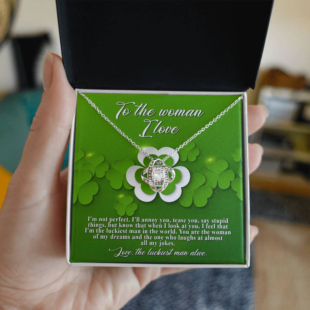 A hand holding a green box with a personalized To My Soulmate, Luckiest Man - Love Knot Necklace from ShineOn Fulfillment.