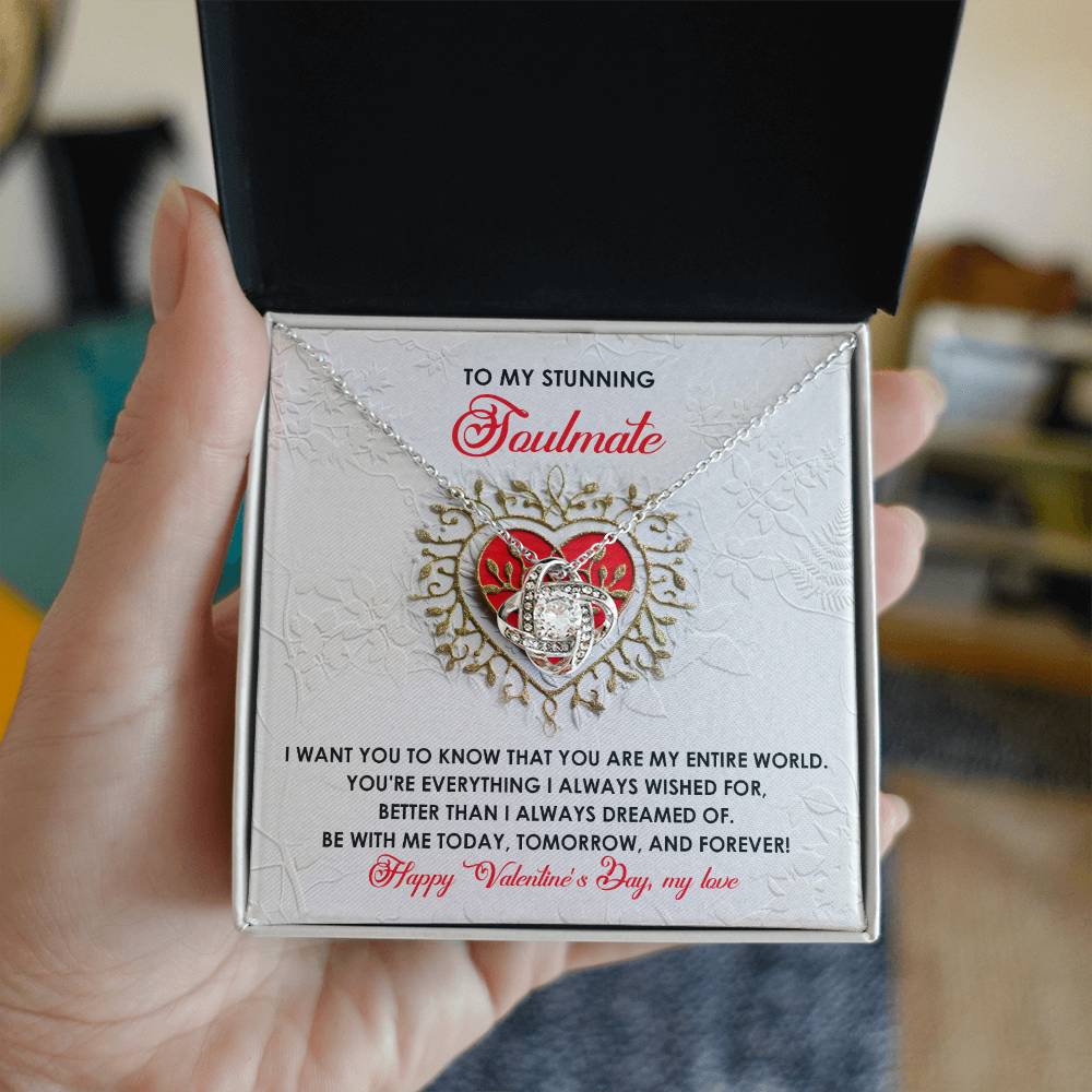 The Soulmate-Be With Me - Love Knot Necklace, displayed in an open box and adorned with cubic zirconia crystals and a soulmate inscription, signifies an unbreakable bond of love and commitment for Valentine's Day.
