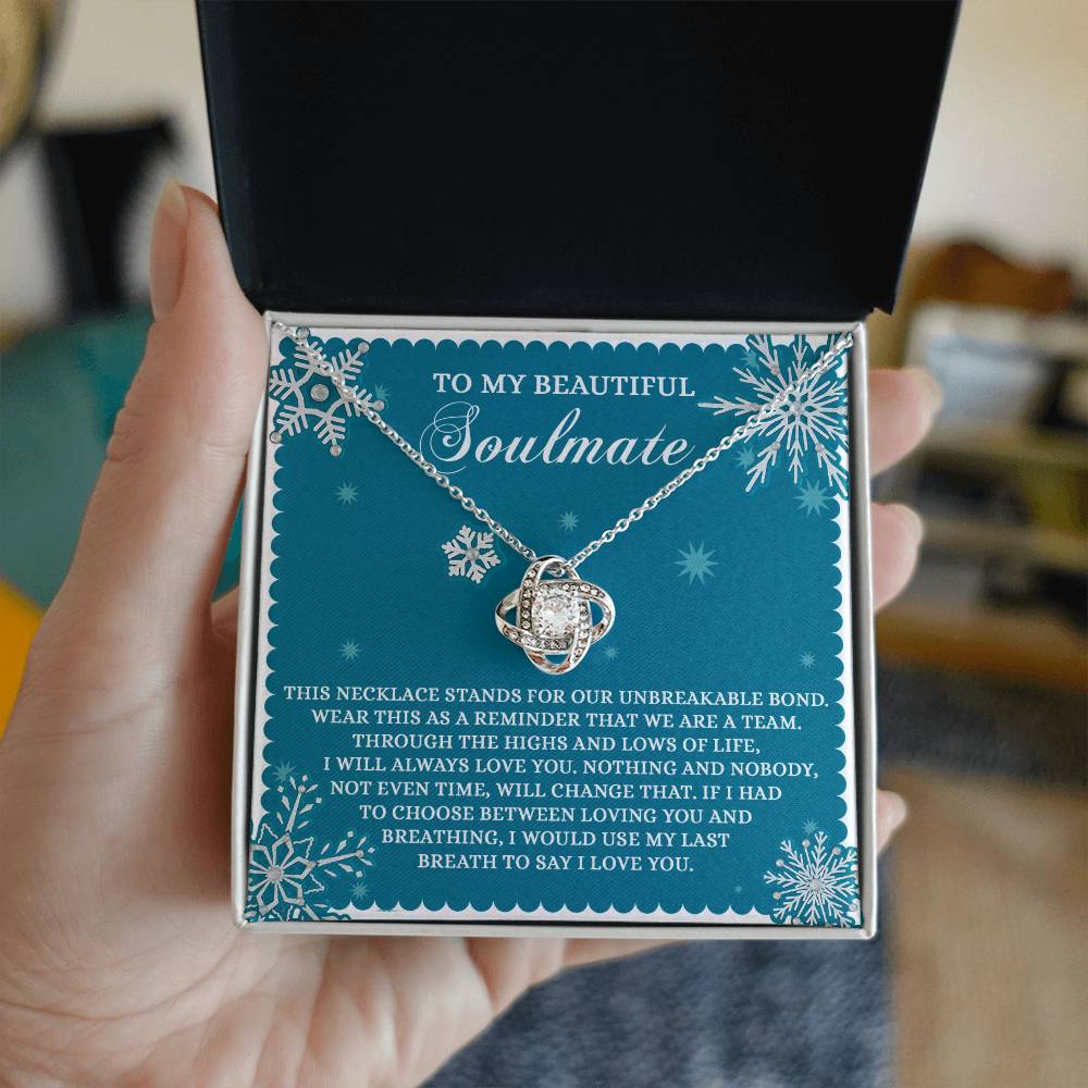 Inside the elegant box lies a breathtaking Soulmate-A Team - Love Knot Necklace, adorned with sparkling Cubic Zirconia Crystals. The box tenderly reads "To My Beautiful Soulmate" and carries a heartfelt message about love and unbreakable bonds.