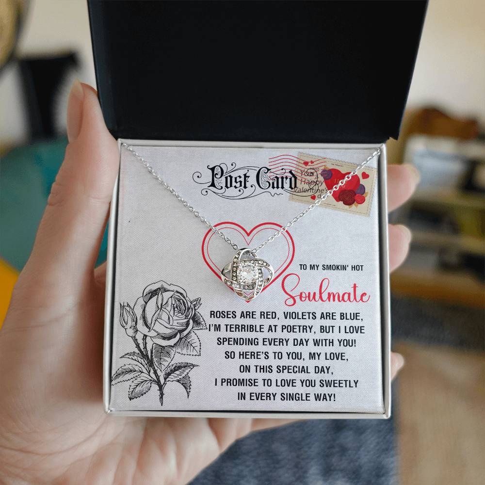 The Soulmate-Special Day Love Knot Necklace, in a heart and rose-themed gift box, sparkles with cubic zirconia crystals. Offered in white or yellow gold finishes, it includes a romantic poem to your "soulmate," symbolizing eternal love perfectly.