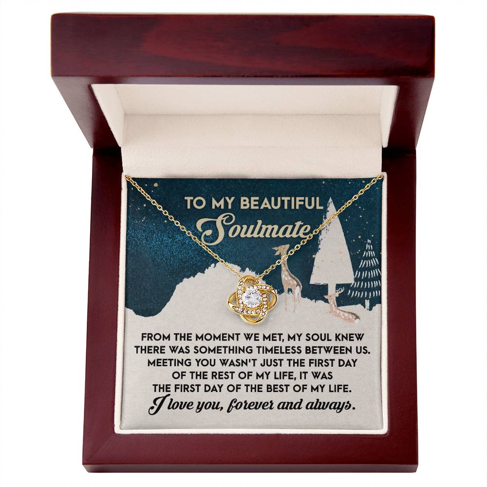 The Soulmate- Between Us - Love Knot Necklace, adorned with cubic zirconia crystals, is beautifully presented in a box. Inside, a message reads, "To my beautiful soulmate," alongside a heartfelt romantic note, making it an ideal personalized gift.