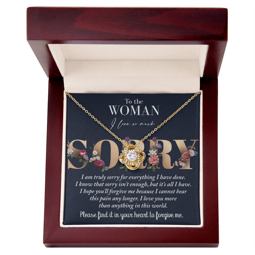 A Sorry-Bear This Pain - Love Knot Necklace in a red wooden box adorned with cubic zirconia crystals, complemented by a heartfelt note that reads: "To the woman I love so much. Sorry. I am truly sorry for everything I have done. Please find it in your heart to forgive me.