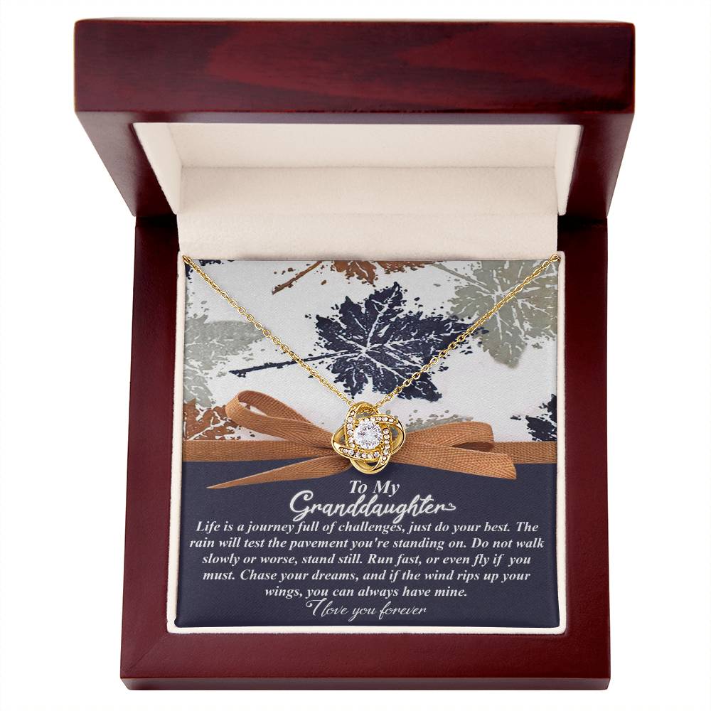 This Granddaughter-Have Mine - Love Knot Necklace makes for a personalized gift, beautifully showcased in a jewelry box. It features sparkling cubic zirconia crystals and includes a heartfelt message for your granddaughter.