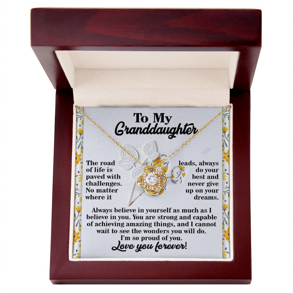 This "Granddaughter-On Your Dreams - Love Knot Necklace" comes in a box with an inspiring message for your granddaughter. It’s crafted from 14k white gold and adorned with sparkling cubic zirconia crystals, featuring encouraging words about self-belief and chasing her dreams.