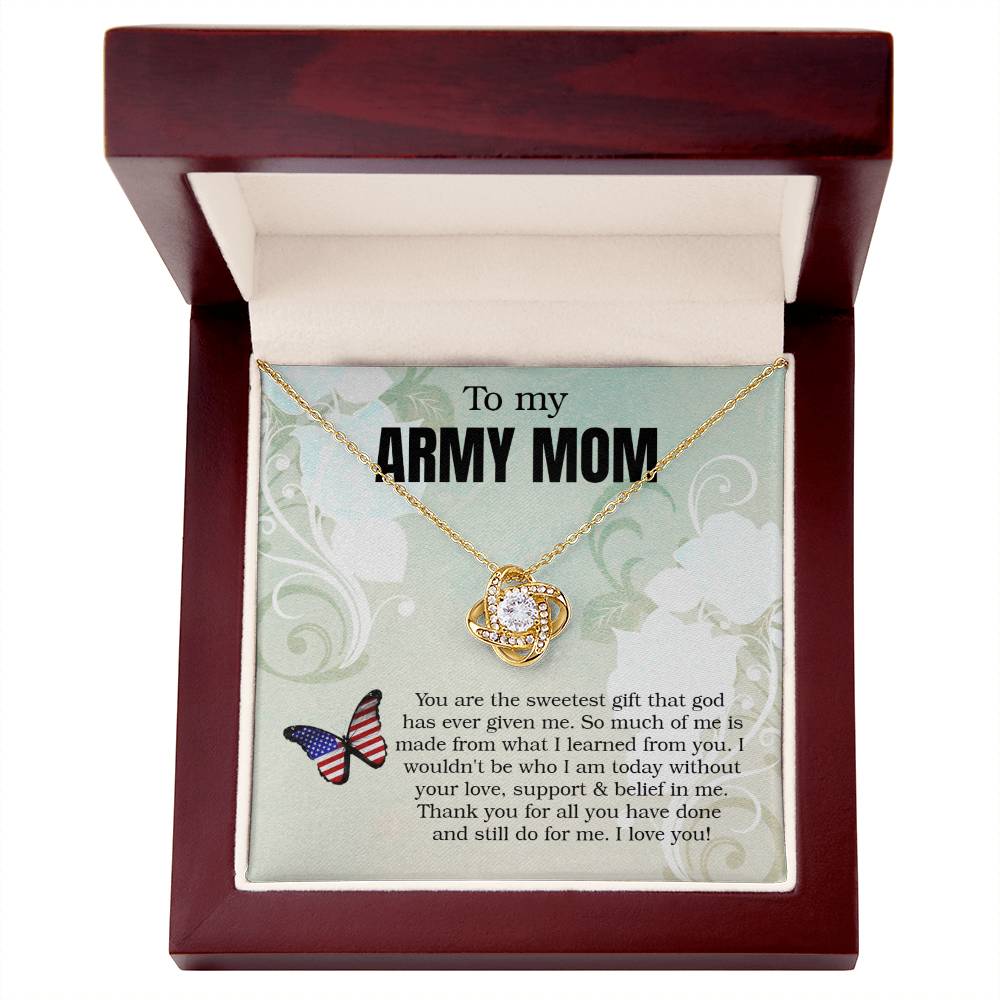 A gold-toned To My Army Mom, You Are The Sweetest Gift That God Has Ever Given Me - Love Knot Necklace with premium cubic zirconia crystals and a circular pendant sits inside a gift box with a printed message for an "army mom," expressing gratitude and love from ShineOn Fulfillment.