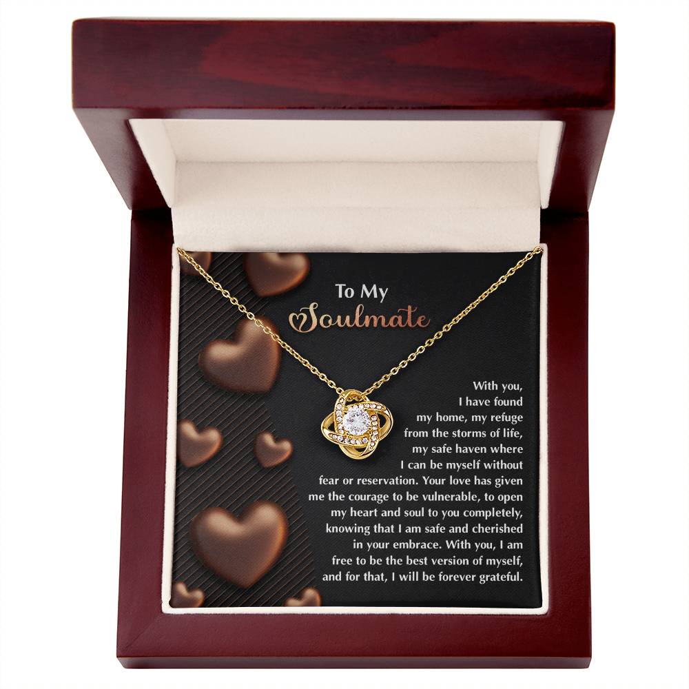 A Soulmate-Best Version - Love Knot Necklace with a central gem comes in an open wooden box. The lid interior features a heartfelt message titled "To My Soulmate," surrounded by hearts and sparkling cubic zirconia crystals for added elegance.