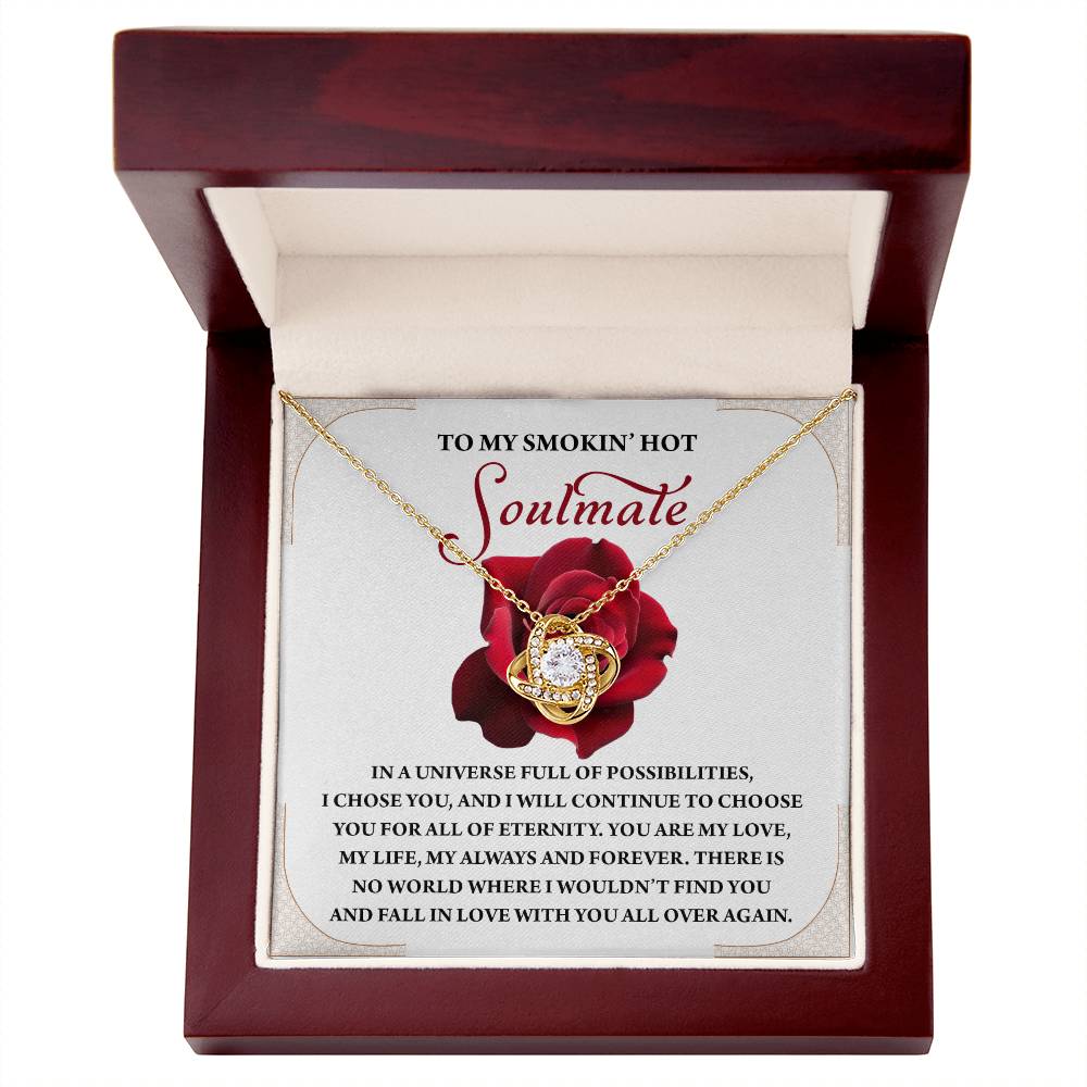 The Soulmate-Over Again Love Knot Necklace features a rose and cubic zirconia crystal pendant, elegantly displayed in a red and white box with a romantic message for your "soulmate," making it an ideal gift.