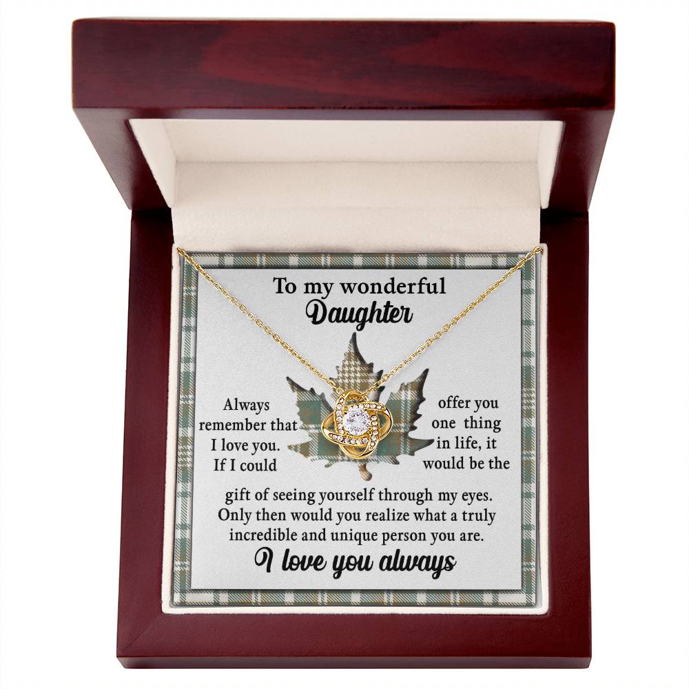 The Daughter-Through My Eyes - Love Knot Necklace, adorned with cubic zirconia crystals, is beautifully displayed in a jewelry box with an open lid. Inside the lid, a heartfelt message reads, "To my wonderful daughter," followed by a touching note about love and appreciation. This personalized gift is perfect for expressing your deepest emotions.