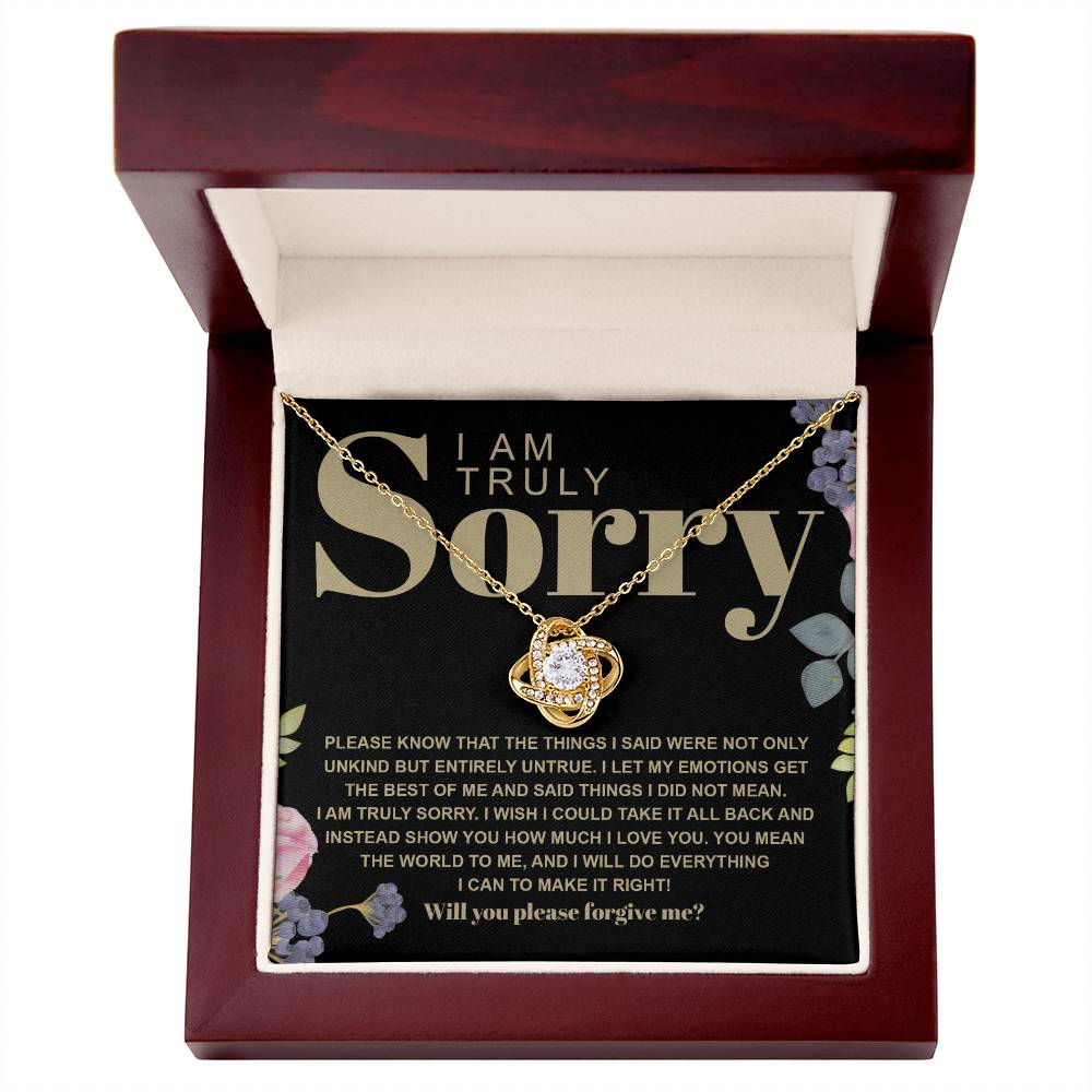 The Sorry-Best Of Me - Love Knot Necklace, featuring a heart-shaped cubic zirconia crystal pendant, is elegantly presented on a card with an apology message expressing deep regret and a sincere plea for forgiveness.