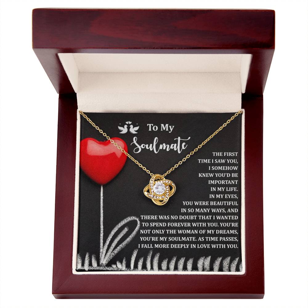 The Soulmate-Forever With You - Love Knot Necklace, adorned with a cubic zirconia stone and white gold finish, sparkles elegantly in a wooden box. The lid features heart and flower designs with "To My Soulmate" above its romantic message.