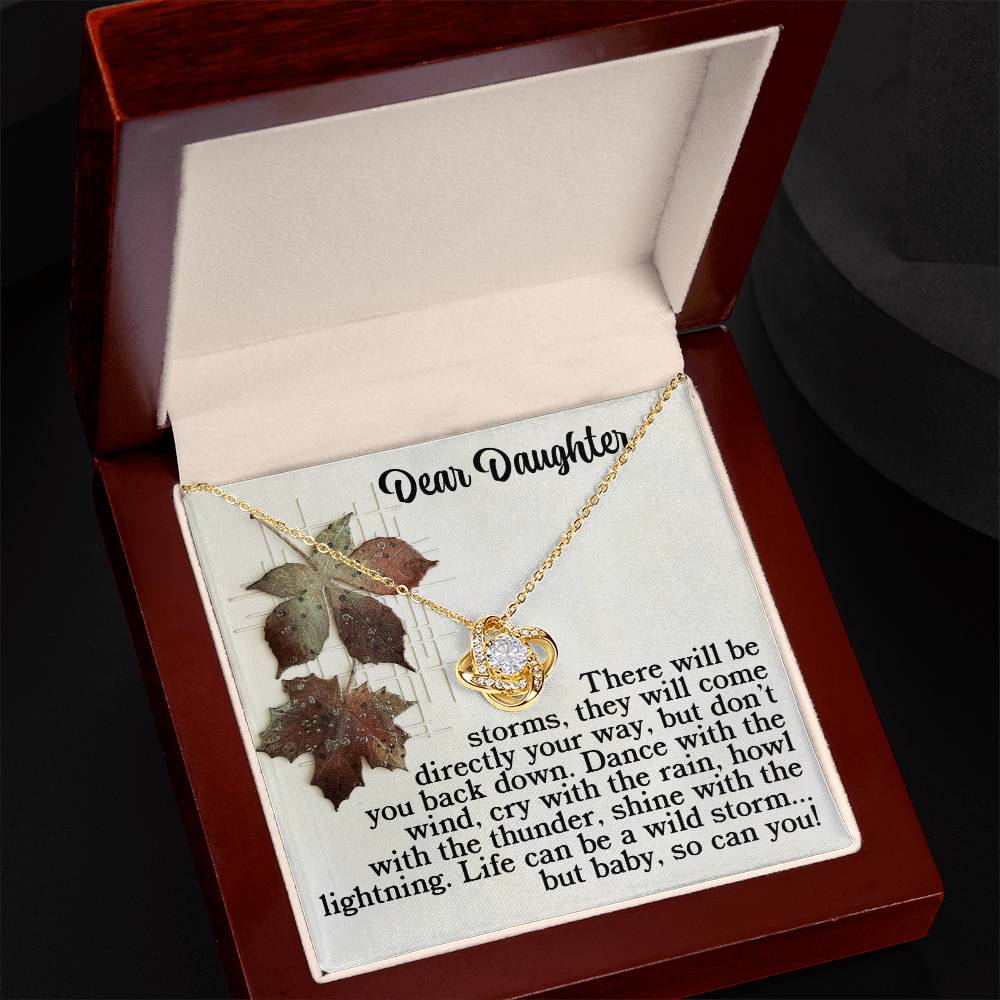The Daughter-With The Thunder - Love Knot Necklace comes in a jewelry box and features stunning cubic zirconia crystals adorning its elegant heart pendant. Enclosed is a card with the heartfelt message, "Dear Daughter," which beautifully conveys sentiments of love and appreciation, making it perfect for any occasion.