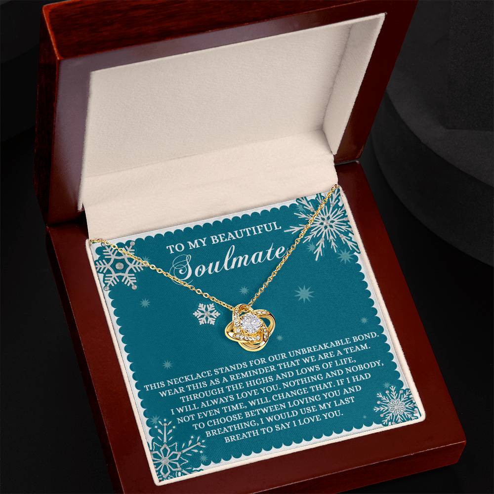 The Soulmate-A Team - Love Knot Necklace, with its elegant heart pendant, is beautifully presented in a red jewelry box, symbolizing our unbreakable bond. Accompanied by a card titled "To My Beautiful Soulmate" featuring a heartfelt message, this truly personalized gift captures the essence of our connection.
