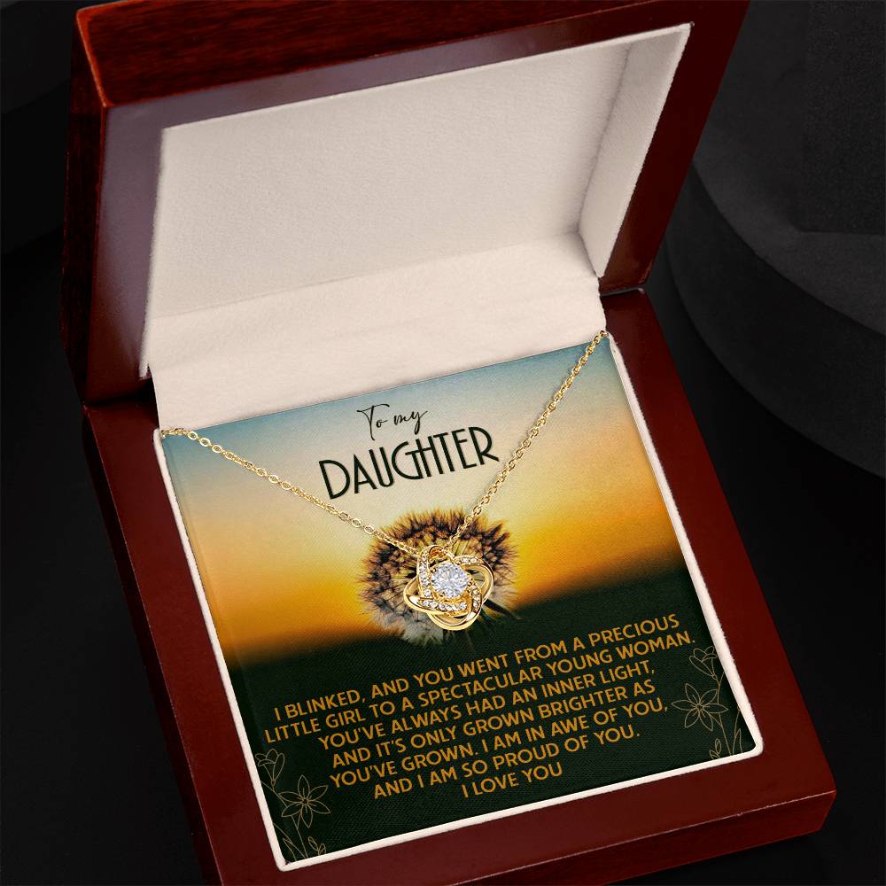 Inside an open box with an engraved message that reads: "To my daughter. I blinked, and you went from a precious little girl to a spectacular young woman..." the Daughter-Grown Brighter - Love Knot Necklace symbolizes the unbreakable bond we share. This beautiful necklace, adorned with cubic zirconia and set in white gold, captures our everlasting connection perfectly.