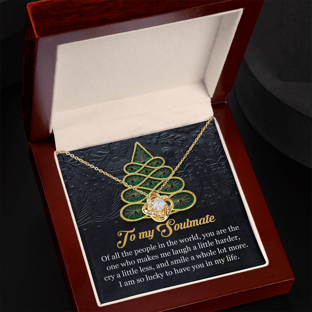 The Soulmate-In My Life - Love Knot Necklace, featuring intertwined heart pendants delicately adorned with shimmering cubic zirconia, comes beautifully packaged in a jewelry box. Inside, a heartfelt message reads: "To my Soulmate. Of all the people in the world, you are the one who makes me laugh, cry, and smile more." It is an ideal personalized gift for your beloved.