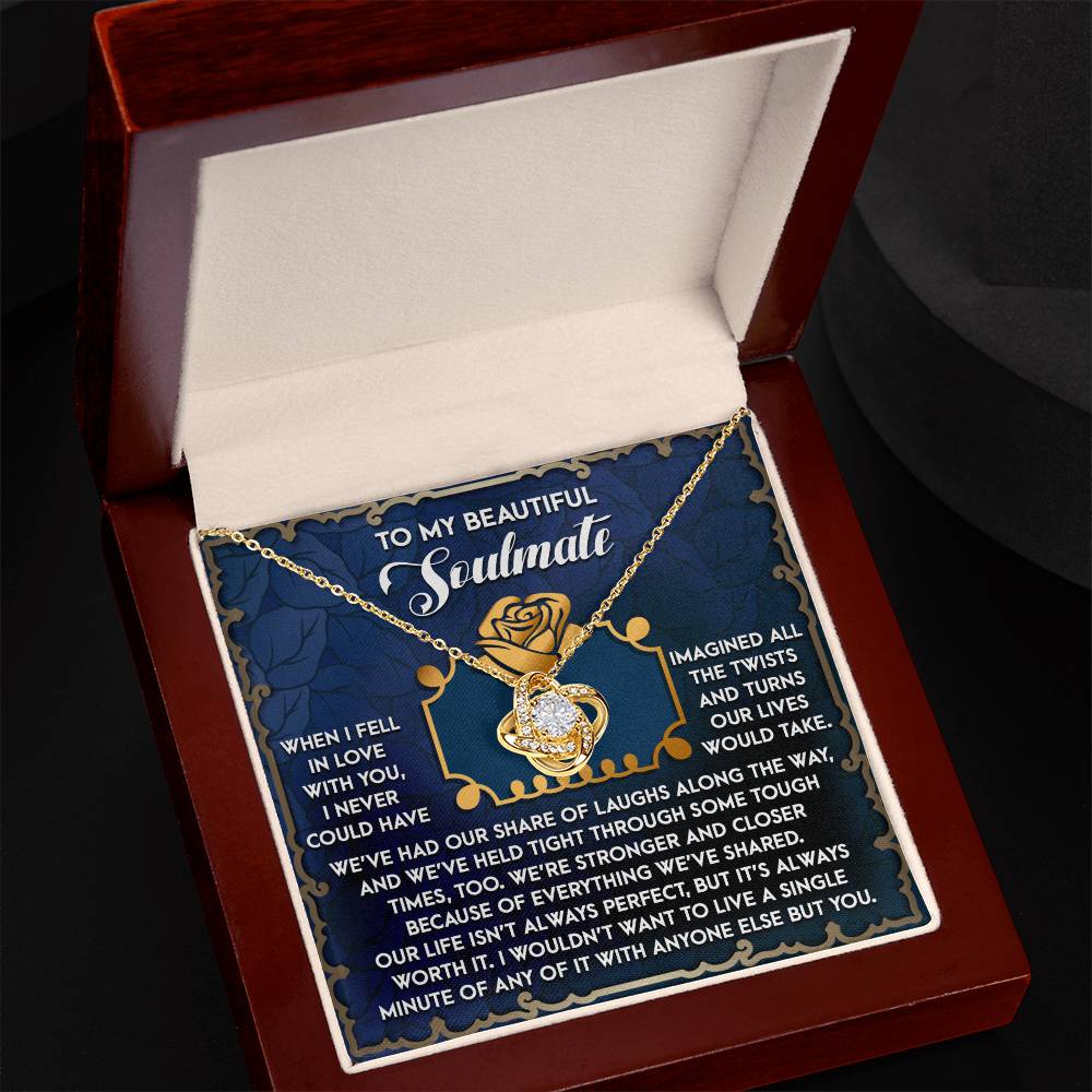 The Soulmate-The Way Love Knot Necklace in 14k white gold, featuring interlocking hearts with cubic zirconia crystals, is elegantly presented in an open velvet box. Accompanied by a "To My Beautiful Soulmate" card with a rose illustration, it makes the perfect romantic gesture.